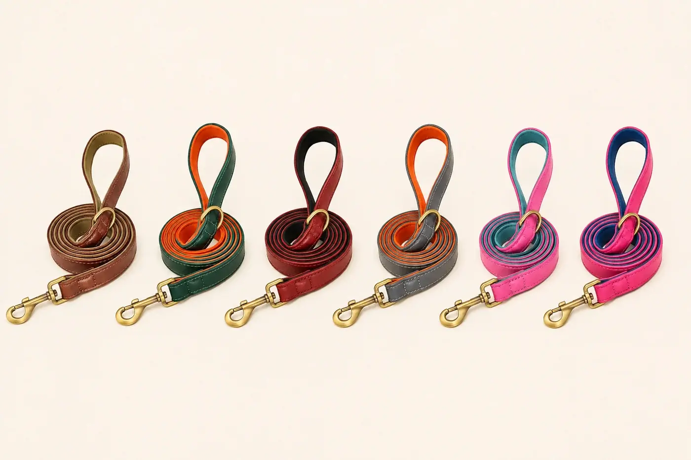 The six leash colors coiled side by side on a cream background: brown, green, red, gray, pink and fuchsia