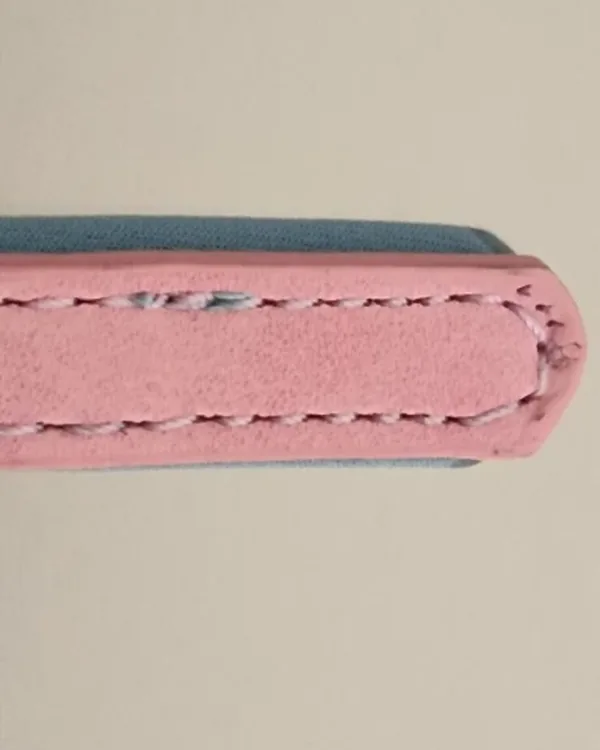 Macro of the stitching running along the edge of the pink strap